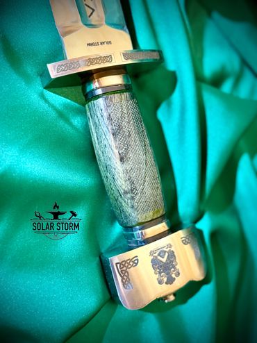 handle of Viking sword by custom sword maker and swordsmith from Alberta Canada complete with Runes