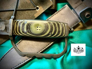 handle with Fluer di lis trench knife by custom alberta blacksmith and bladesmtih - solarstorm