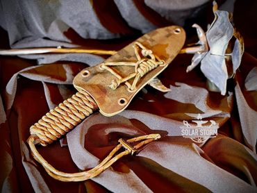 Tactical dagger by Custom Alberta Bladesmith complete with paracord handle in its kydex sheath