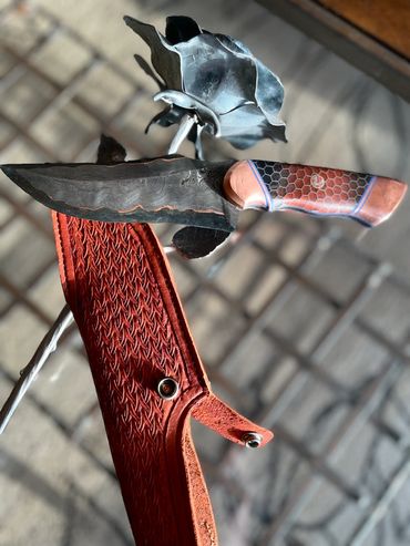 in sunshite Damascus CuMai hunting knife.  on sheath