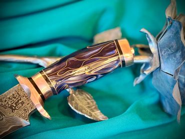 Handle of a CuMai Damascus knife with Copper Accents by Custom Albert Bladesmith Solar Storm - Bob B