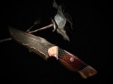 240 layer Damascus CuMai hunting knife.  15n20 and 1084 copper shims epoxy dragon scales handle
