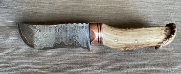 cumai damascus skinning knife custom filework on spine