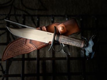 blade detail Take down Bowie blade with ring guard elk antler handle.