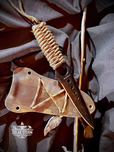 Tactical dagger by Custom Alberta Bladesmith complete with paracord handle and kydex sheath