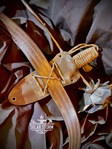 Vertical mount of a Tactical dagger by Custom Alberta Bladesmith complete with paracord handle and k