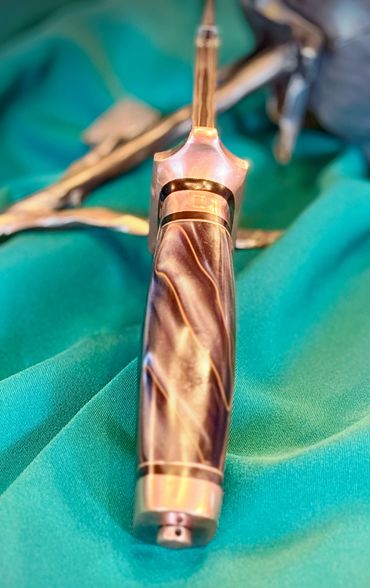 Top View of a CuMai Damascus knife with Copper Accents by Custom Albert Bladesmith Solar Storm - Bob