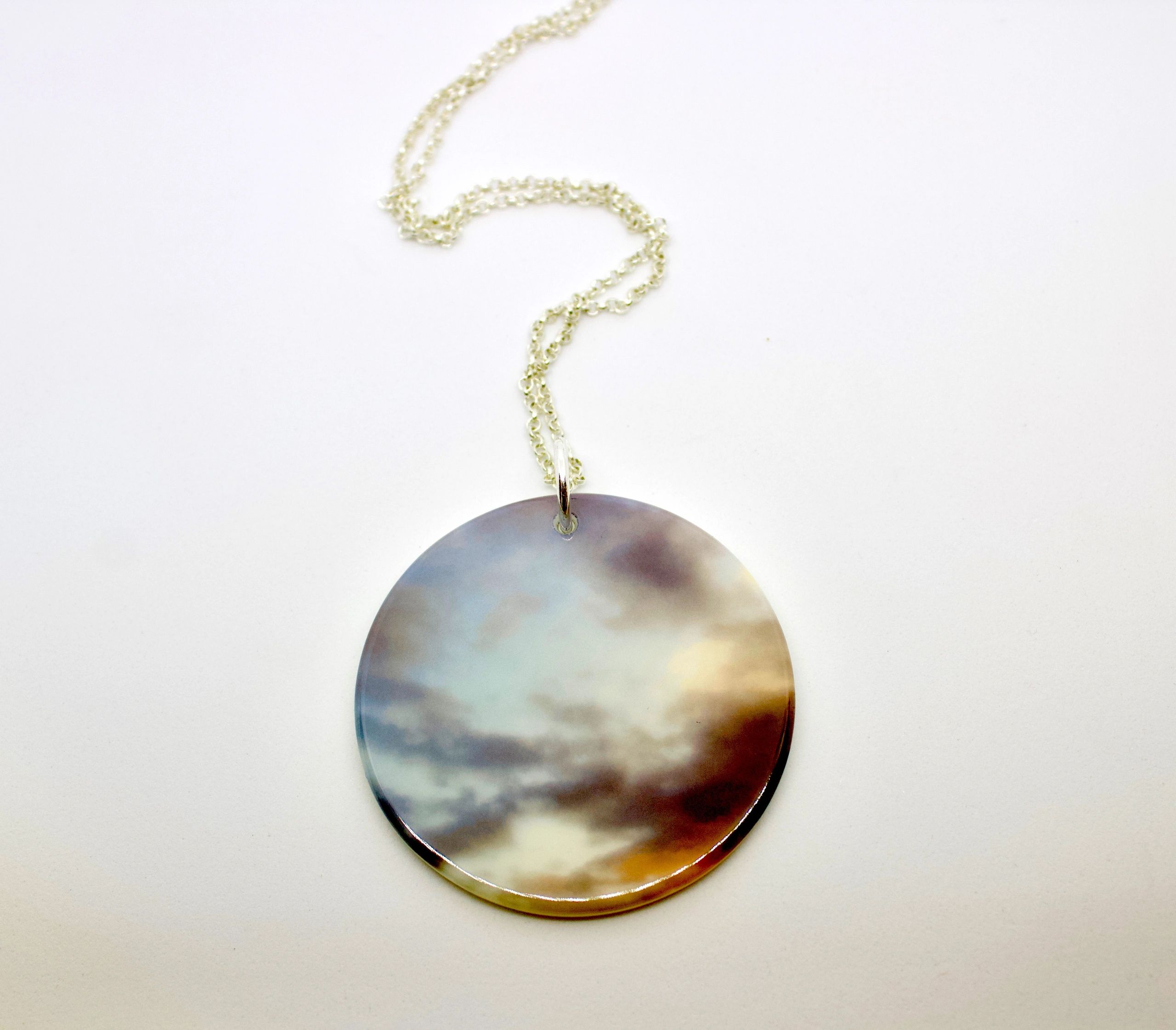 Sky Chronicle Neckpiece, fused glass with photo graphic decal on sterling silver.