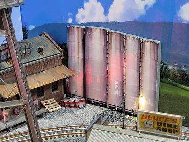 Photo Submitted by Bryan
O Scale 5 tanks building flat