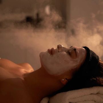 Woman relaxing with a facial mask.