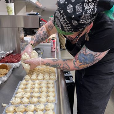cook preparing dessert for catering