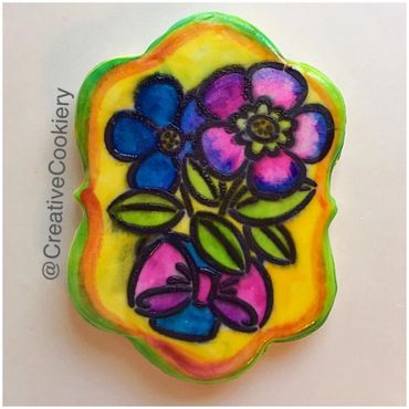Beautiful spring flowers created on our Paint Your Own cookie.
