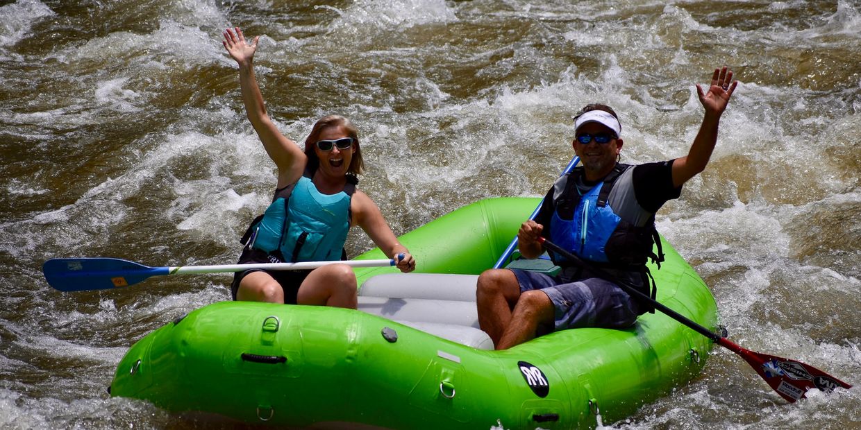 Brenna and Anthony whitewater rafting on the Pigeon River.