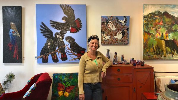 Didi La Baÿsse among some of her paintings.
