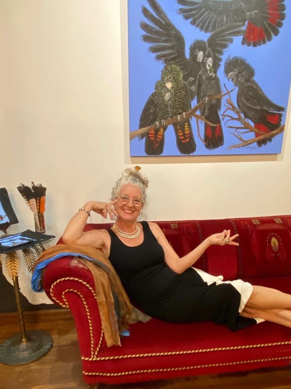 Didi La Baÿsse with her painting 'It’s All About the Nut'