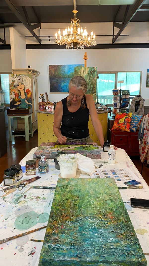 Didi La Baÿsse at her work station, creating 'An Important Call'