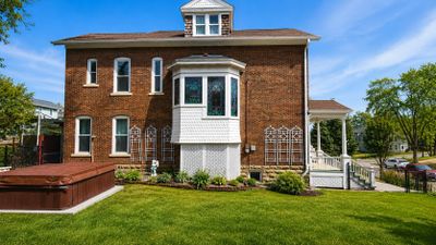 Historic brick home in Dubuque Iowa featuring traditional masonry construction, detailed architectur