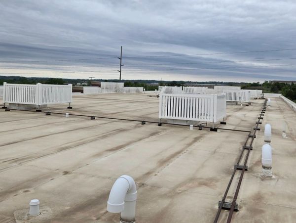 Flat commercial roofing system during a commercial property inspection by Gold Shield Inspections in