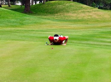 The golfer watching the ball