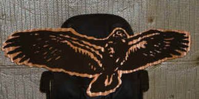 Multi-layered sign of a Condor made from copper and steel that was painted black.