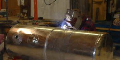 Aluminum welding being performed on a tank.