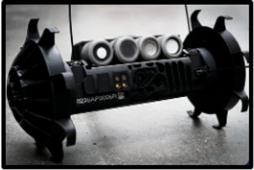 Black robotic device with wheels and sensor array on a concrete floor.