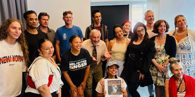Group of diverse people smiling indoors.