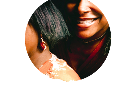 Close-up of two women, one smiling.