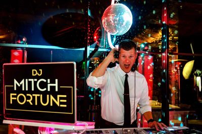 Owner DJ Mitch Fortune spinning at an asheville wedding