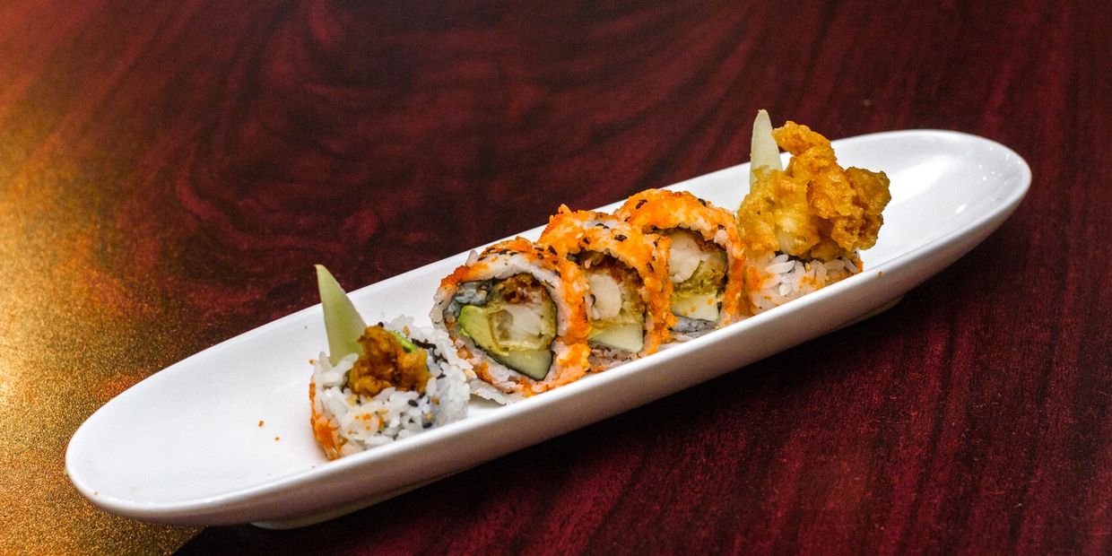 A Plate of Sushi Roll in White Color