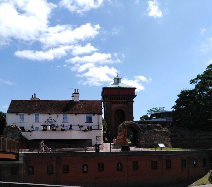 A view of Jumbo water tower, the Mercury Theatre behind the Roman Wall and the Hole in the Wall pub
