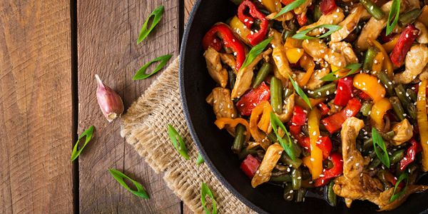 Stir fried chicken with bell peppers and sesame seeds.