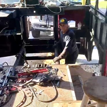 Alex working in the engine compartment after removing the motor