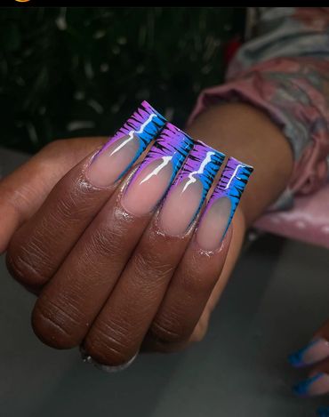 Woman holding out her hand to showcase her freshly painted nails.