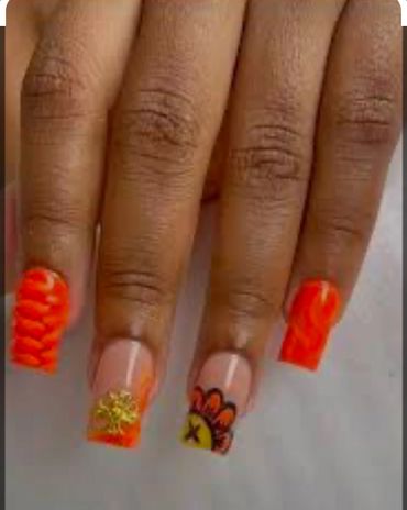 Combination of Orange and black color   nail paint with hands.