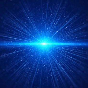 Bright blue light bursts with radiant beams and particles in a dark space.