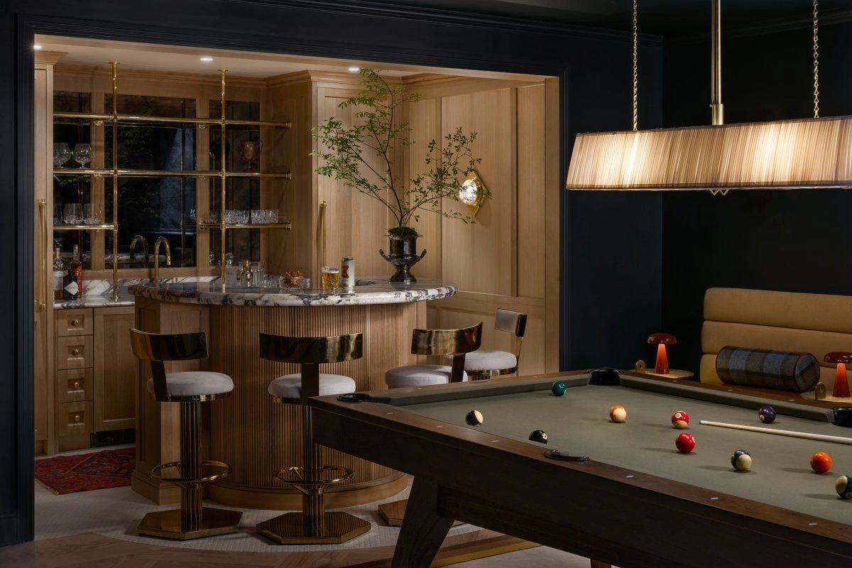Custom bar with inset cabinetry in a natural finish.