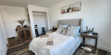 Bright bedroom with cozy bed and minimalist decor.