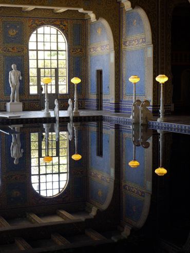Marble statues reflect in an indoor pool at Hearst Castle in San Simeon California