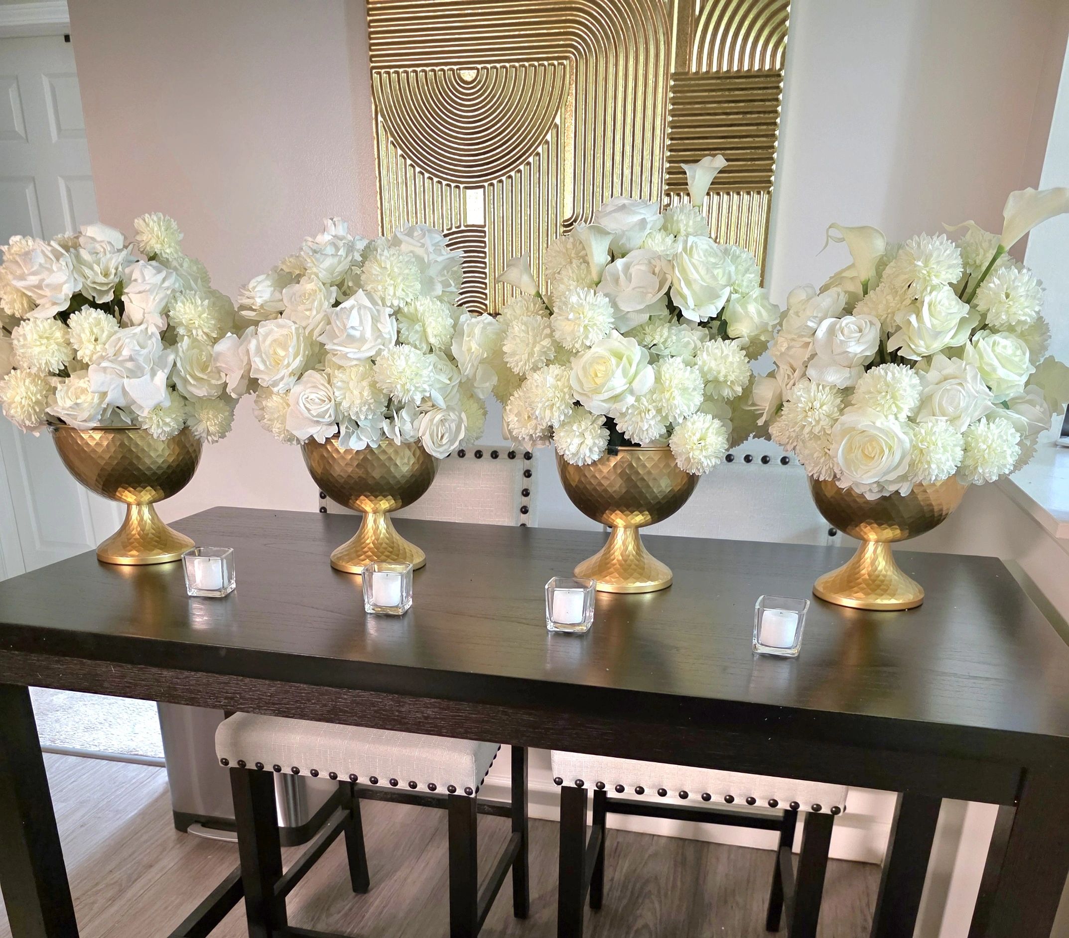 Timeless white floral vessels, designed to bring elegance and refined beauty to your celebration.