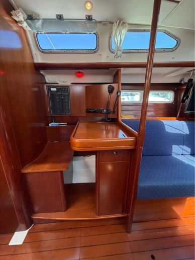 Wooden interior desk and blue sofa on a boat.