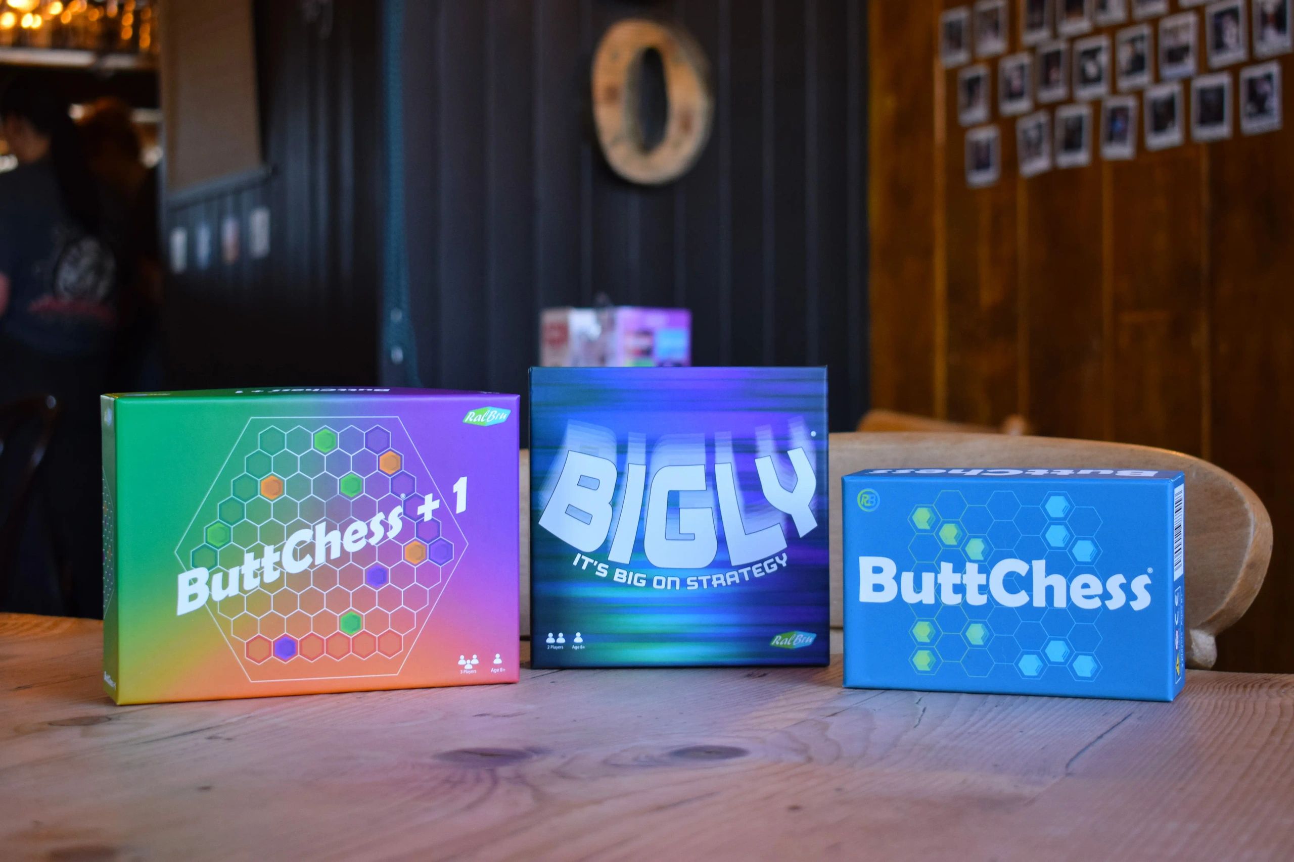 Our three game ButtChess, Bigly and ButtChess + 1, pictured on a table
