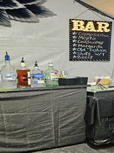 two satellite bar with cocktails and liquor bottles