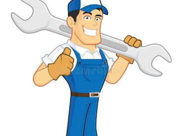 Smiling handyman in blue overalls holding a large wrench and giving a thumbs up.
