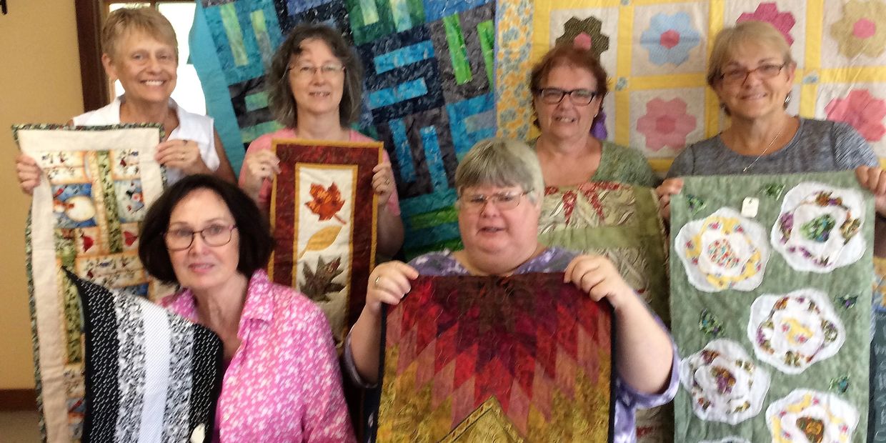 Quilt group showing quilts