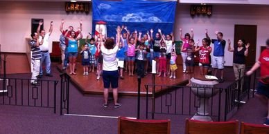 Children of all ages acting out a skit in church