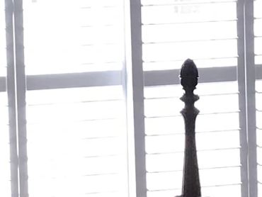 Plantation shutters in bedroom, Orange County