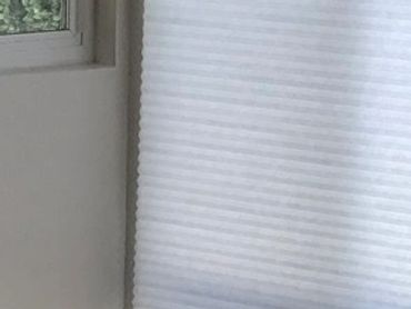 Cellular shades in empty room, Orange County