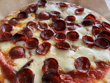 Gluten free 12" pizza topped with pepperoni (the kind that cups!)