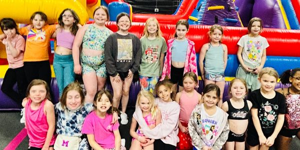 A party at Fargo All Stars in front of the bounce house